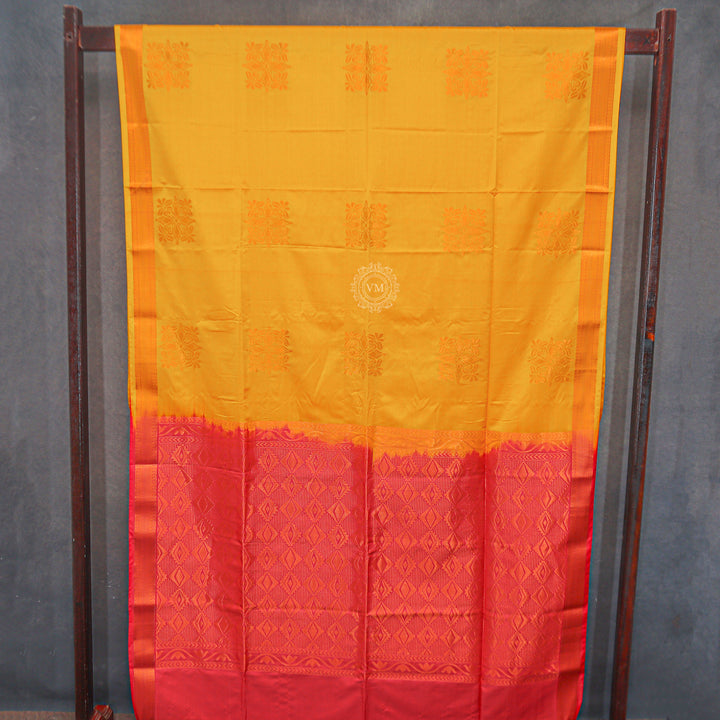 VM23083530 Yellowish orange with Pinkish Semi soft silk saree