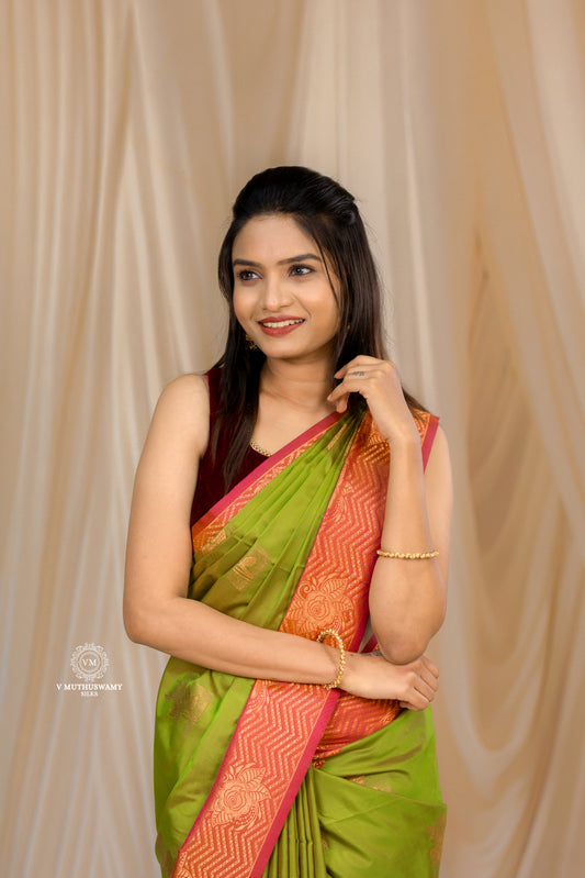 Parrot Green with Orange Semi Soft Silk Saree